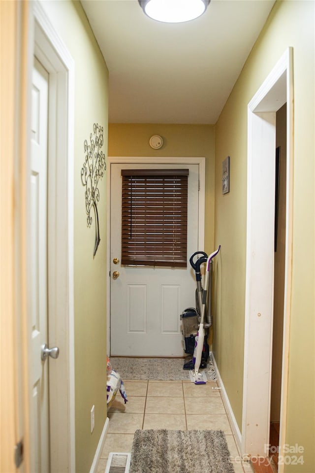 hallway with light tile patterned floors