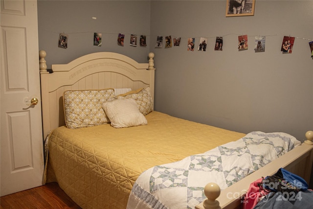 bedroom with wood-type flooring