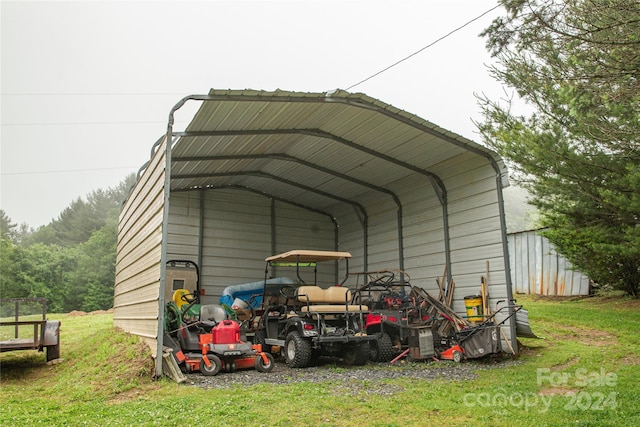 view of outbuilding featuring a carport and a lawn