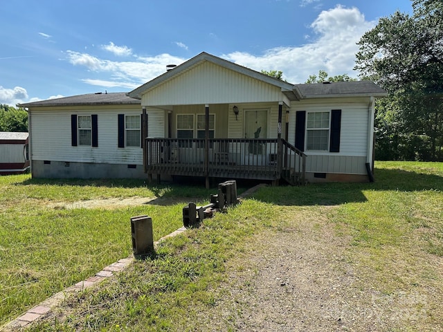 view of front facade with covered porch and a front lawn