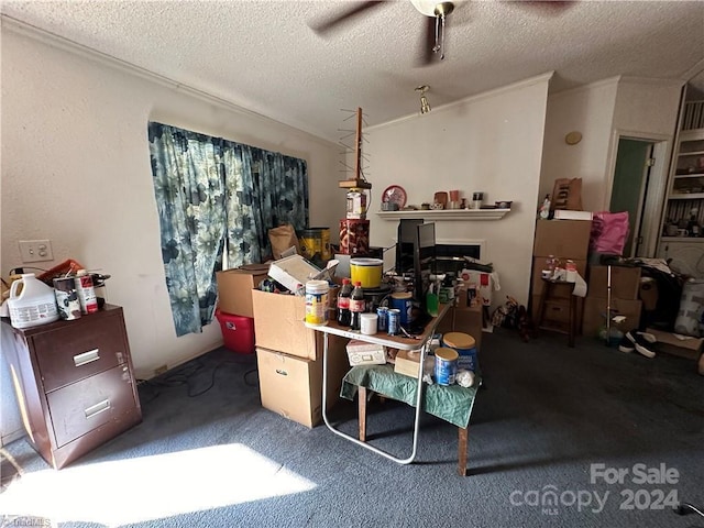 office space with ceiling fan, dark carpet, and a textured ceiling