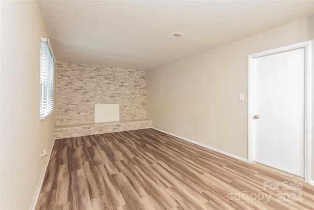 empty room with wood-type flooring