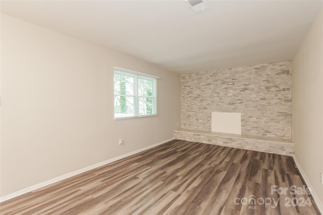 empty room featuring hardwood / wood-style flooring