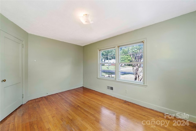 spare room featuring light hardwood / wood-style flooring