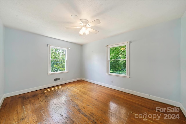 unfurnished room featuring ceiling fan and wood-type flooring