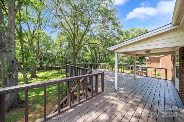 deck featuring a yard