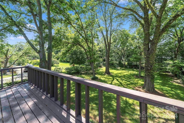 deck featuring a lawn