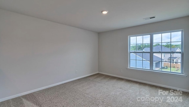 unfurnished room with carpet flooring