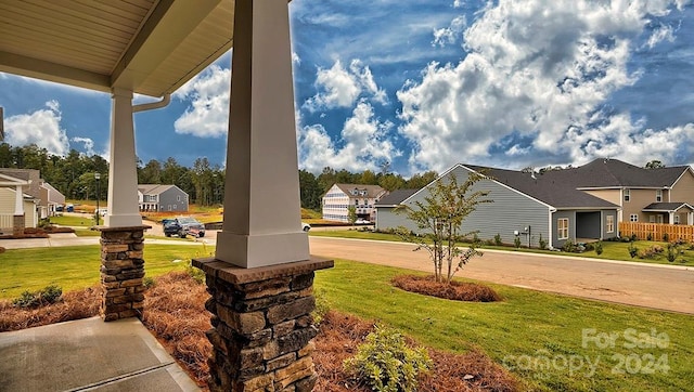 view of yard featuring covered porch