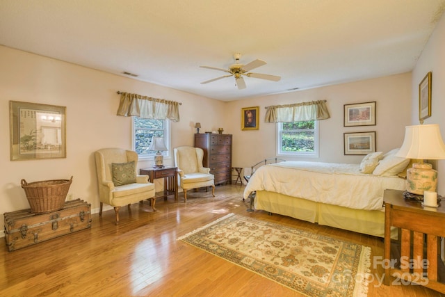 bedroom featuring ceiling fan and wood-type flooring