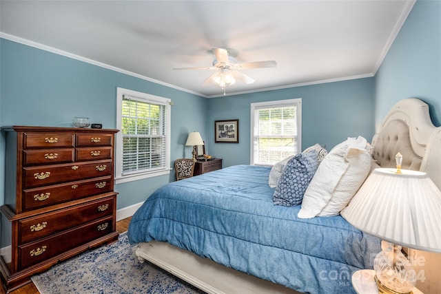 bedroom with ceiling fan, wood-type flooring, and crown molding