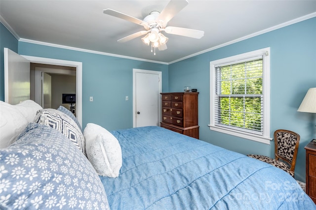 bedroom with ceiling fan and crown molding