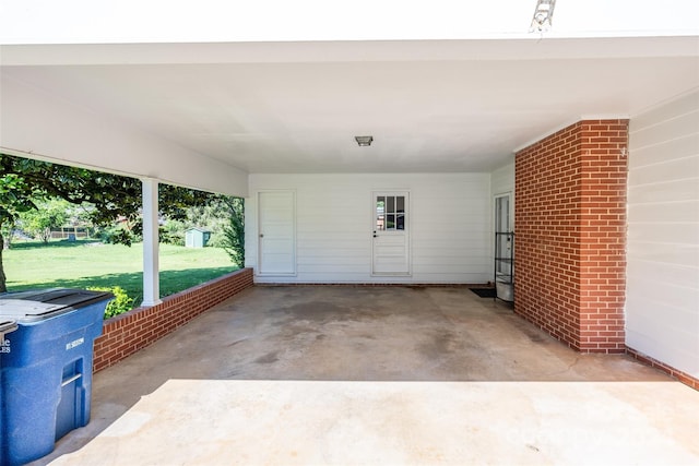 exterior space featuring a lawn and a carport