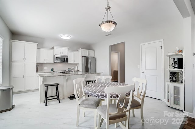 dining area with sink and beverage cooler