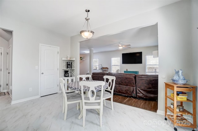 dining space featuring ceiling fan