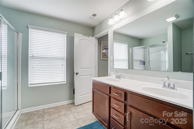 bathroom featuring vanity and walk in shower