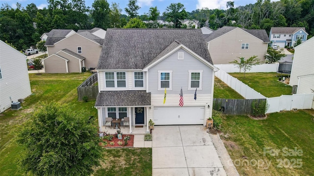 front of property featuring cooling unit, a garage, and a front yard