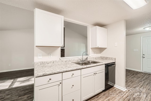 kitchen with white cabinets, black dishwasher, hardwood / wood-style flooring, and sink