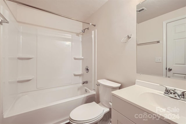 full bathroom featuring vanity,  shower combination, and toilet