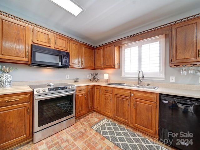 kitchen featuring sink and black appliances