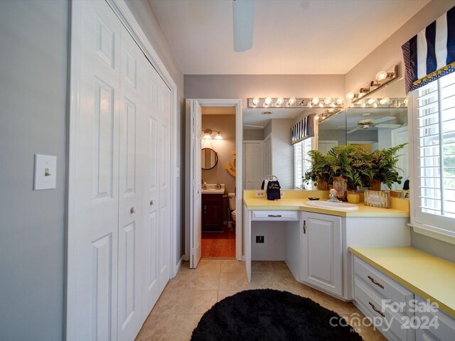 bathroom featuring ceiling fan, vanity, tile patterned flooring, and plenty of natural light