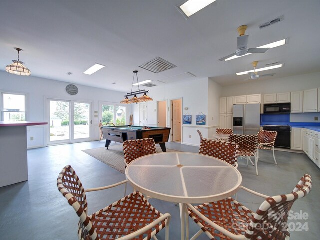 dining space with ceiling fan and pool table