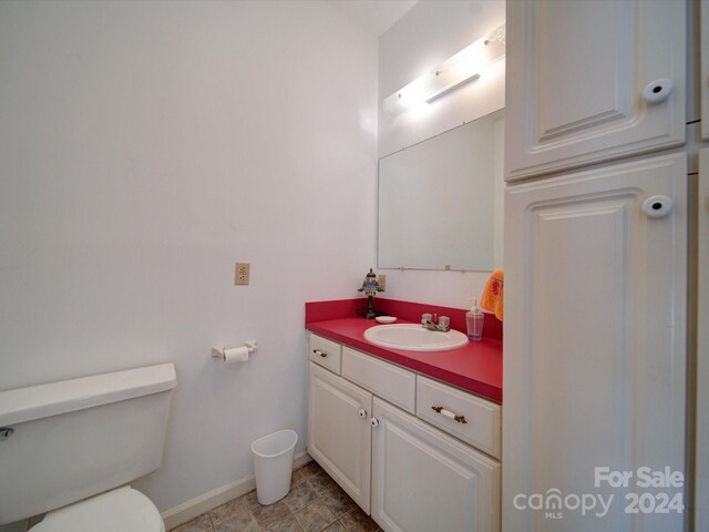 bathroom with toilet and vanity