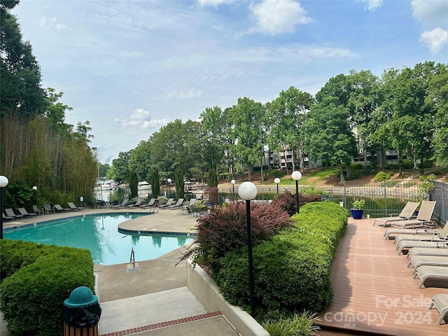 view of swimming pool featuring a patio area