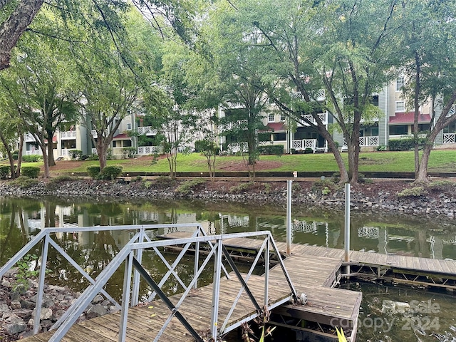 dock area featuring a water view