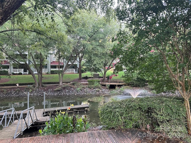 exterior space with a boat dock and a water view