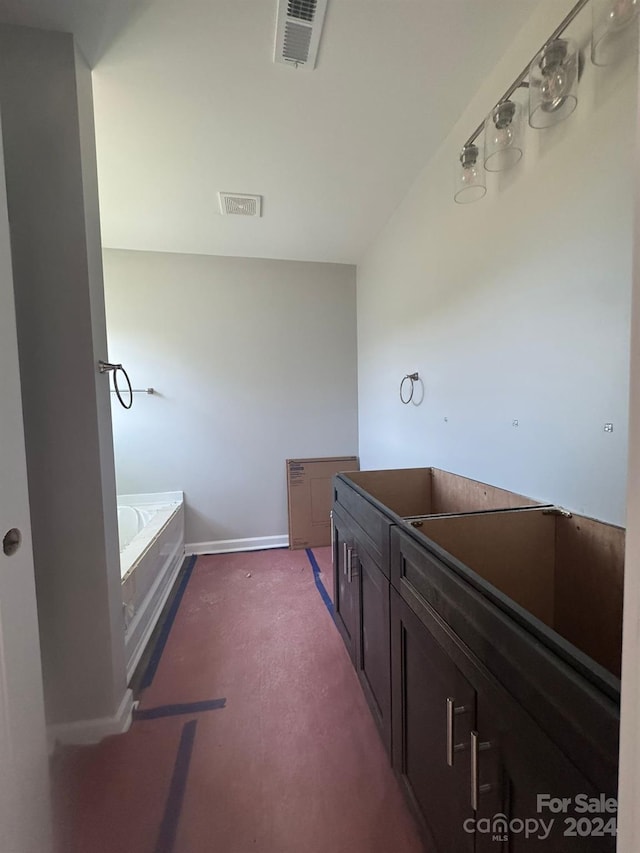 bathroom featuring a washtub