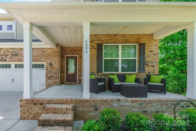 property entrance with covered porch and a garage