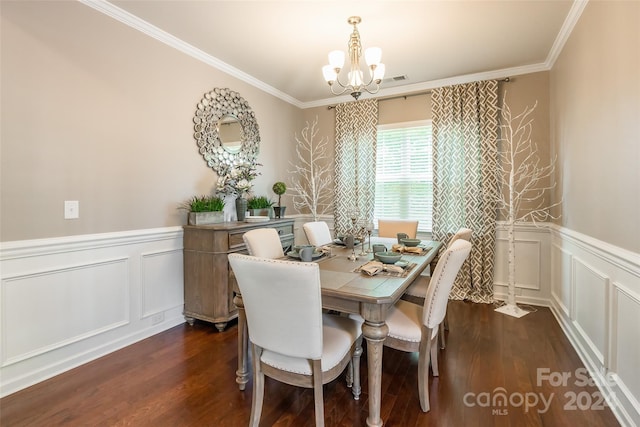 dining room featuring a chandelier, dark hardwood / wood-style flooring, and crown molding