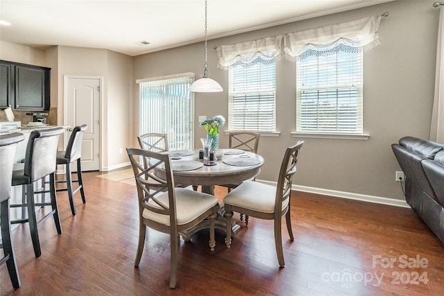 dining space featuring dark hardwood / wood-style floors