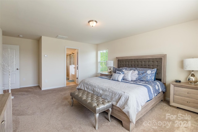 carpeted bedroom with connected bathroom