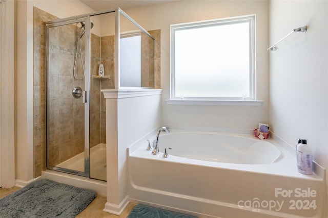 bathroom featuring plus walk in shower