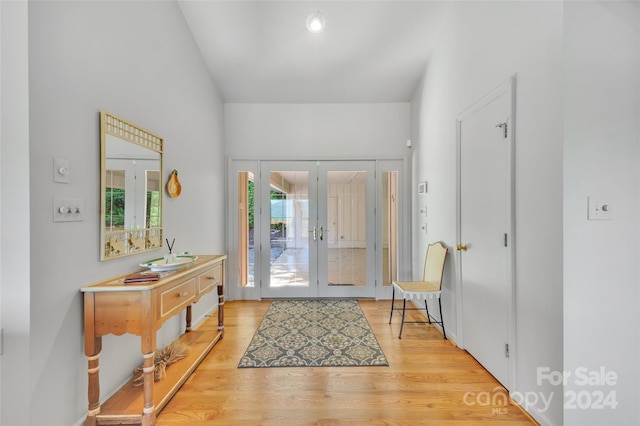 foyer featuring french doors and light wood-type flooring