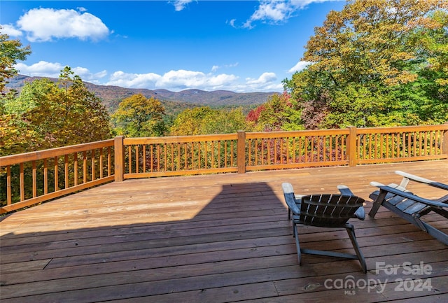 wooden deck with a mountain view