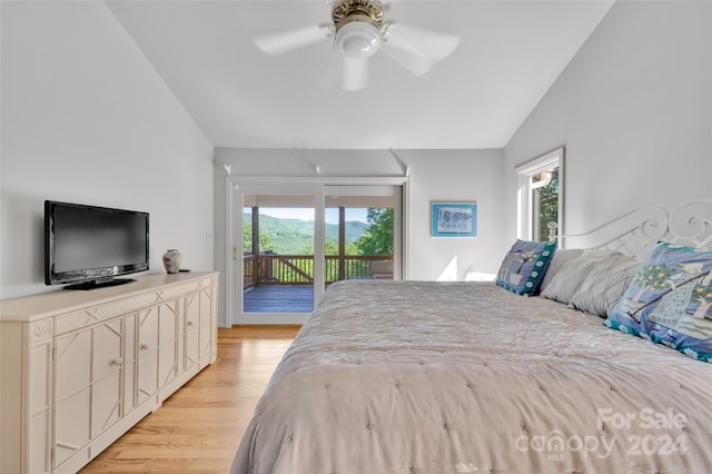 bedroom featuring ceiling fan, light wood-type flooring, access to outside, and vaulted ceiling