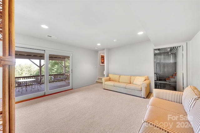 living room featuring light colored carpet