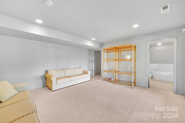 unfurnished living room with light colored carpet