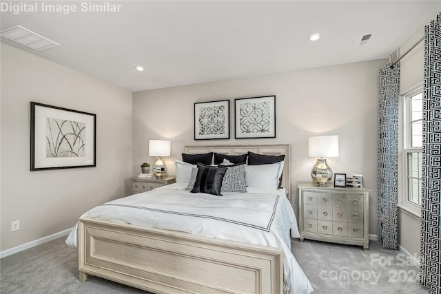 carpeted bedroom featuring recessed lighting, visible vents, and baseboards