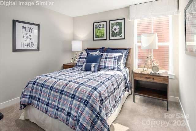 carpeted bedroom featuring baseboards