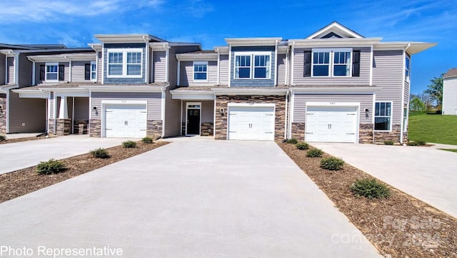 townhome / multi-family property featuring a garage