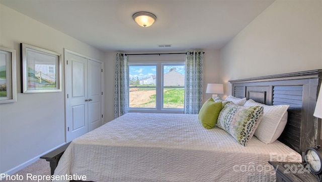 bedroom featuring a closet and carpet floors