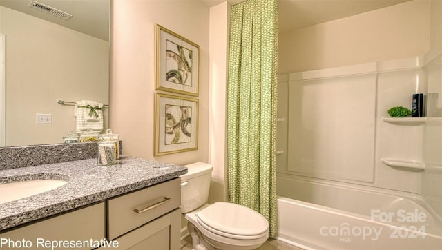 full bathroom featuring shower / tub combo, vanity, and toilet