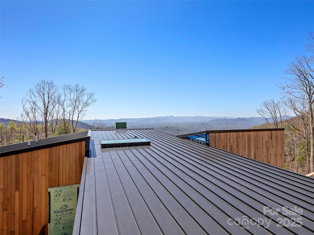 wooden deck featuring a mountain view