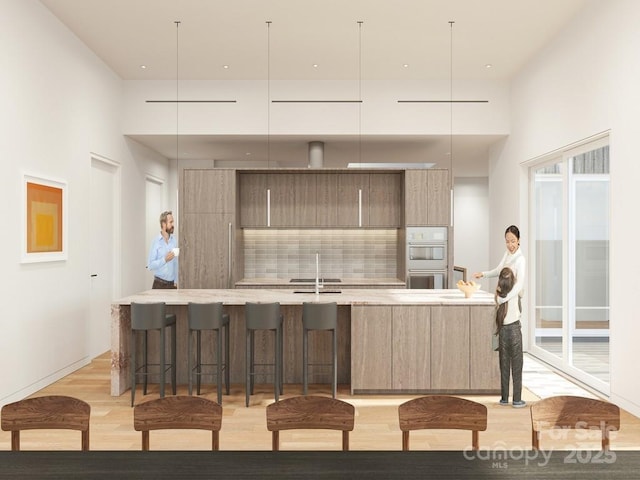 kitchen with a sink, decorative backsplash, modern cabinets, and white double oven
