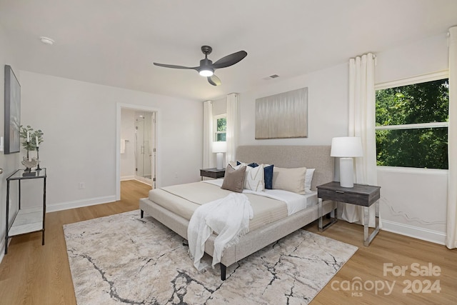 bedroom featuring hardwood / wood-style floors and ceiling fan