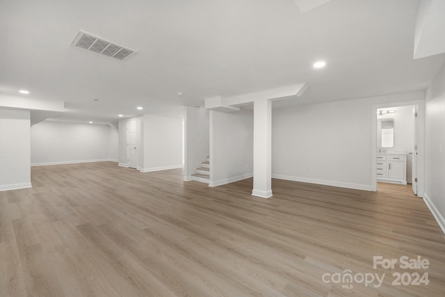 basement featuring light wood-type flooring